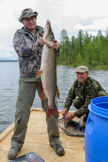 Vladimir Putin and Dmitry Medvedev on holiday