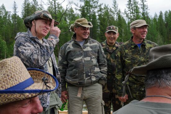 Vladimir Putin and Dmitry Medvedev on holiday