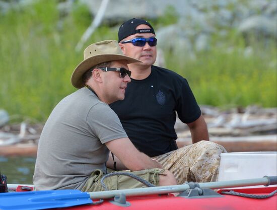 Vladimir Putin and Dmitry Medvedev on holiday