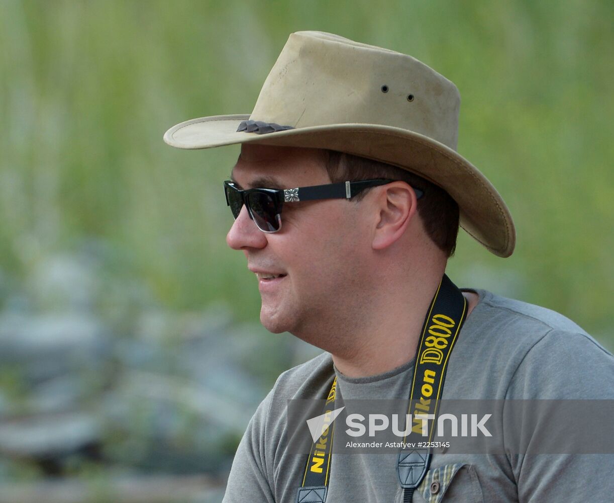 Vladimir Putin and Dmitry Medvedev on holiday