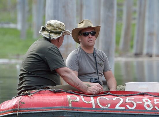 Vladimir Putin and Dmitry Medvedev on holiday
