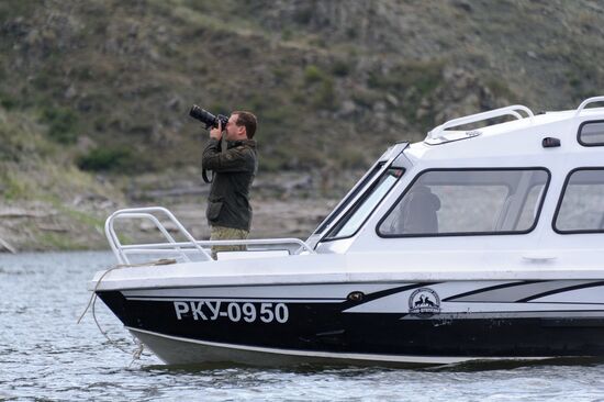 Vladimir Putin and Dmitry Medvedev on holiday