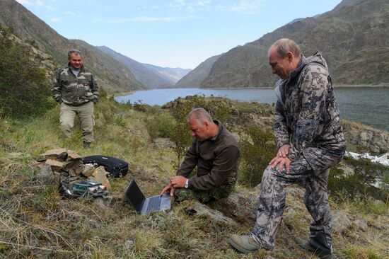 Vladimir Putin and Dmitry Medvedev on holiday