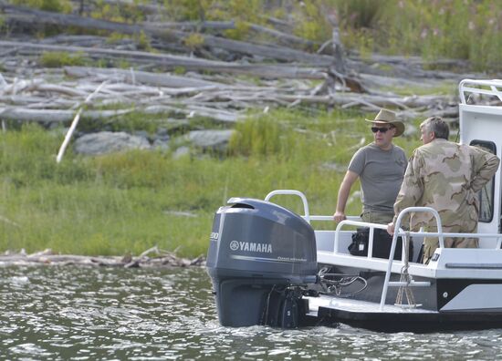 Vladimir Putin and Dmitry Medvedev on holiday