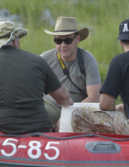 Vladimir Putin and Dmitry Medvedev on holiday