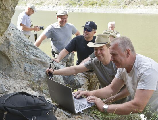 Vladimir Putin and Dmitry Medvedev on holiday