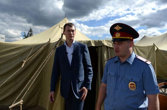 Mikhail Degtyarev visits camp for illegal migrants