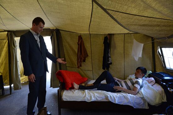 Mikhail Degtyarev visits camp for illegal migrants