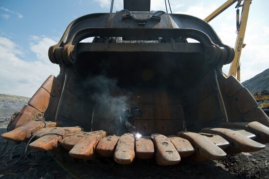Mining coal at Bachatsky coal strip mine