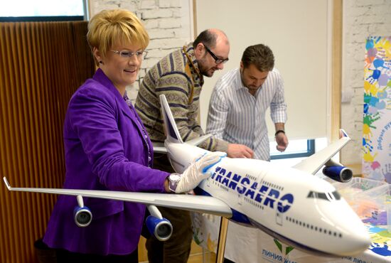 Presentation of Boeing 747 featuring Life Line Fund symbols