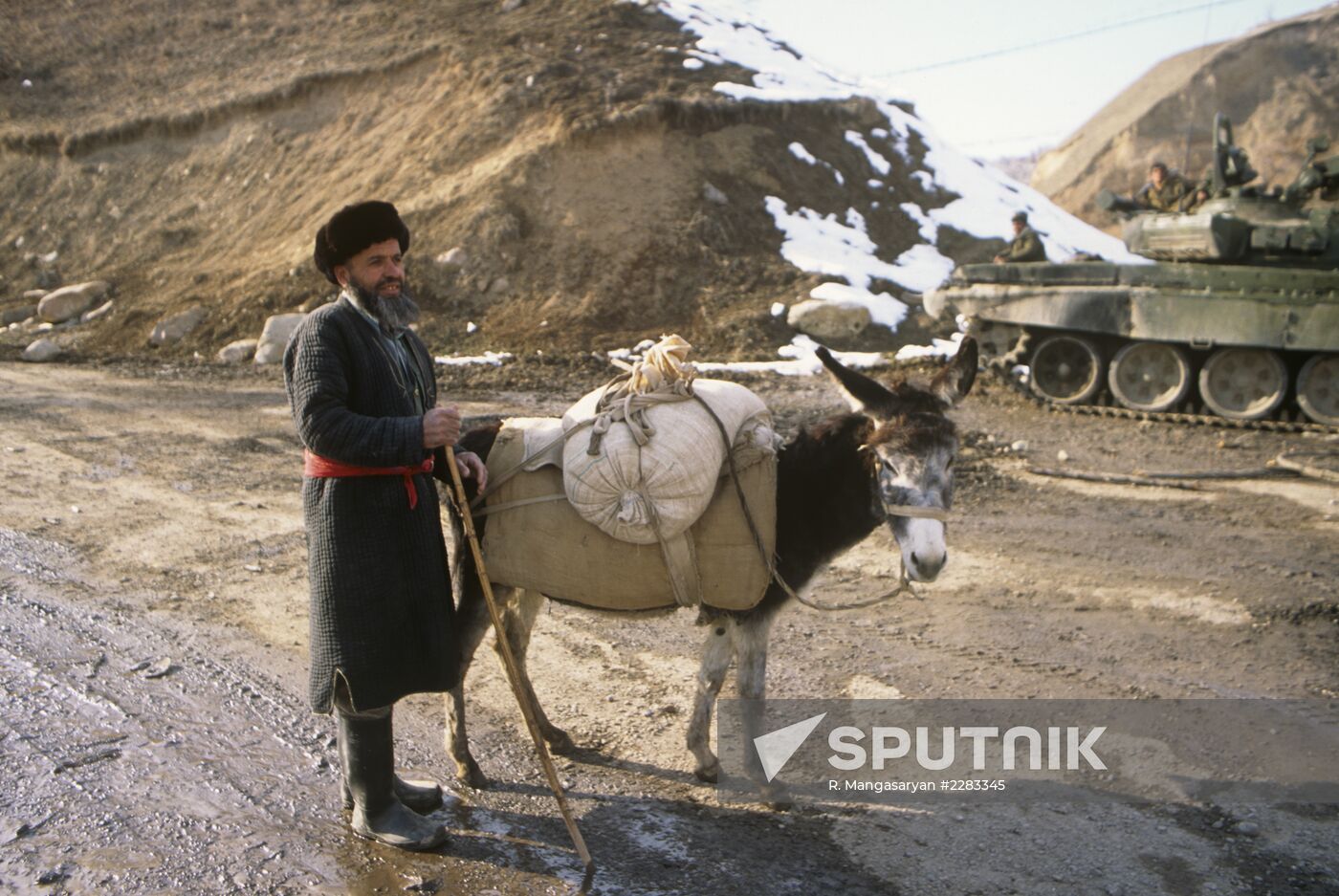 Tajik man with donkey