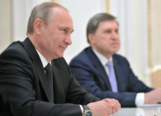 Vladimir Putin meets with Henry Kissinger