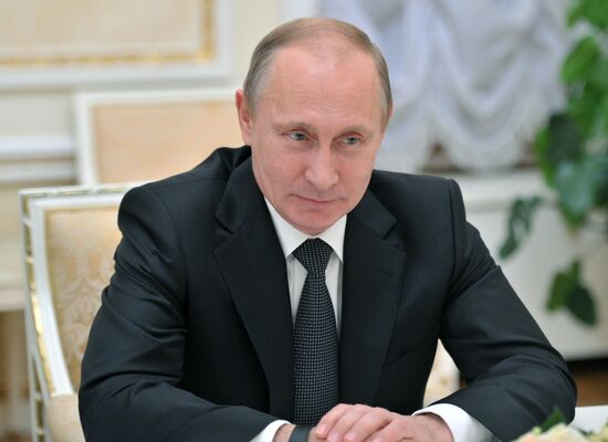 Vladimir Putin meets with Henry Kissinger
