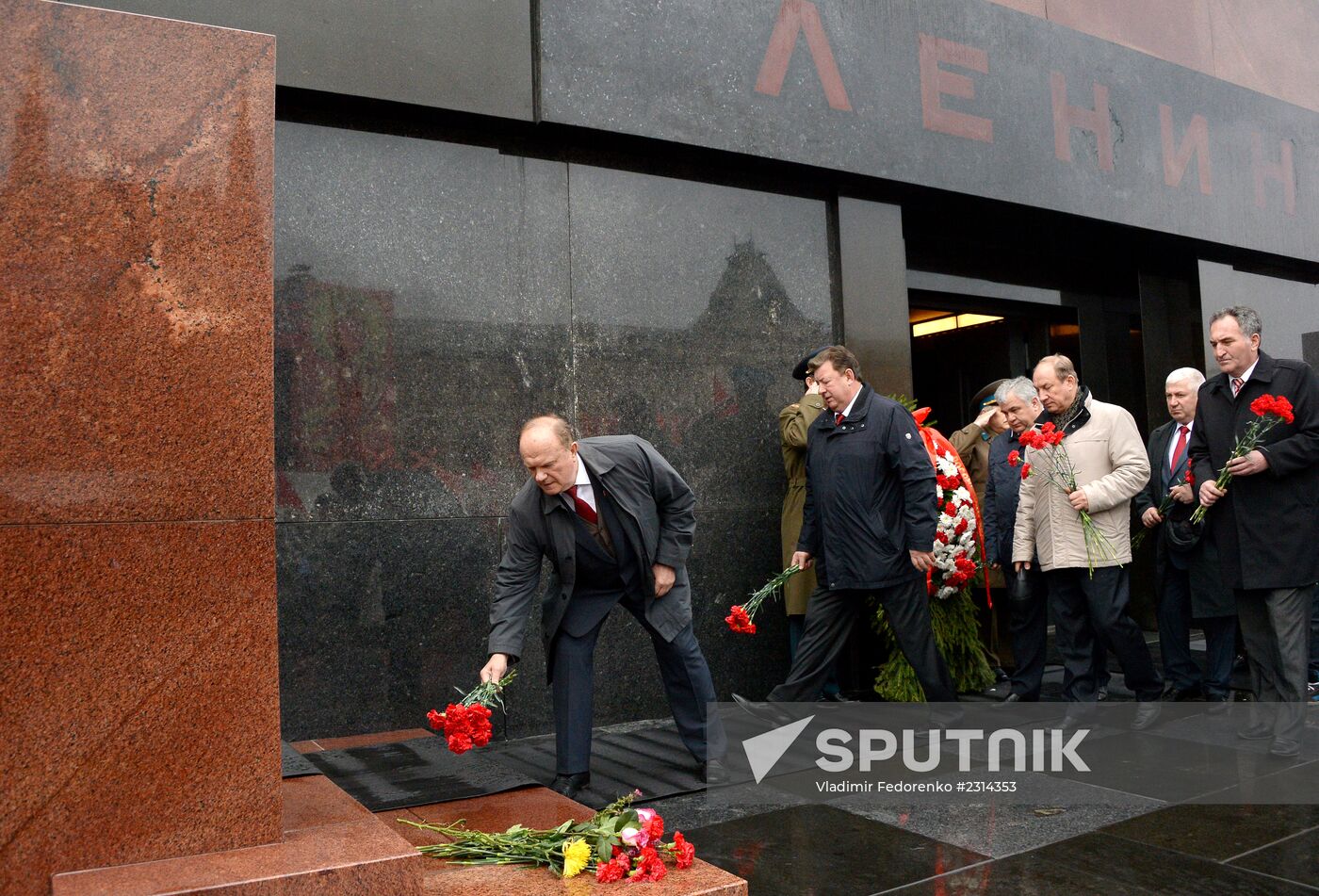 Laying flowers to Lenin Mausoleum on Red Square