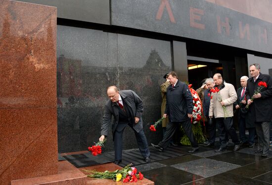 Laying flowers to Lenin Mausoleum on Red Square