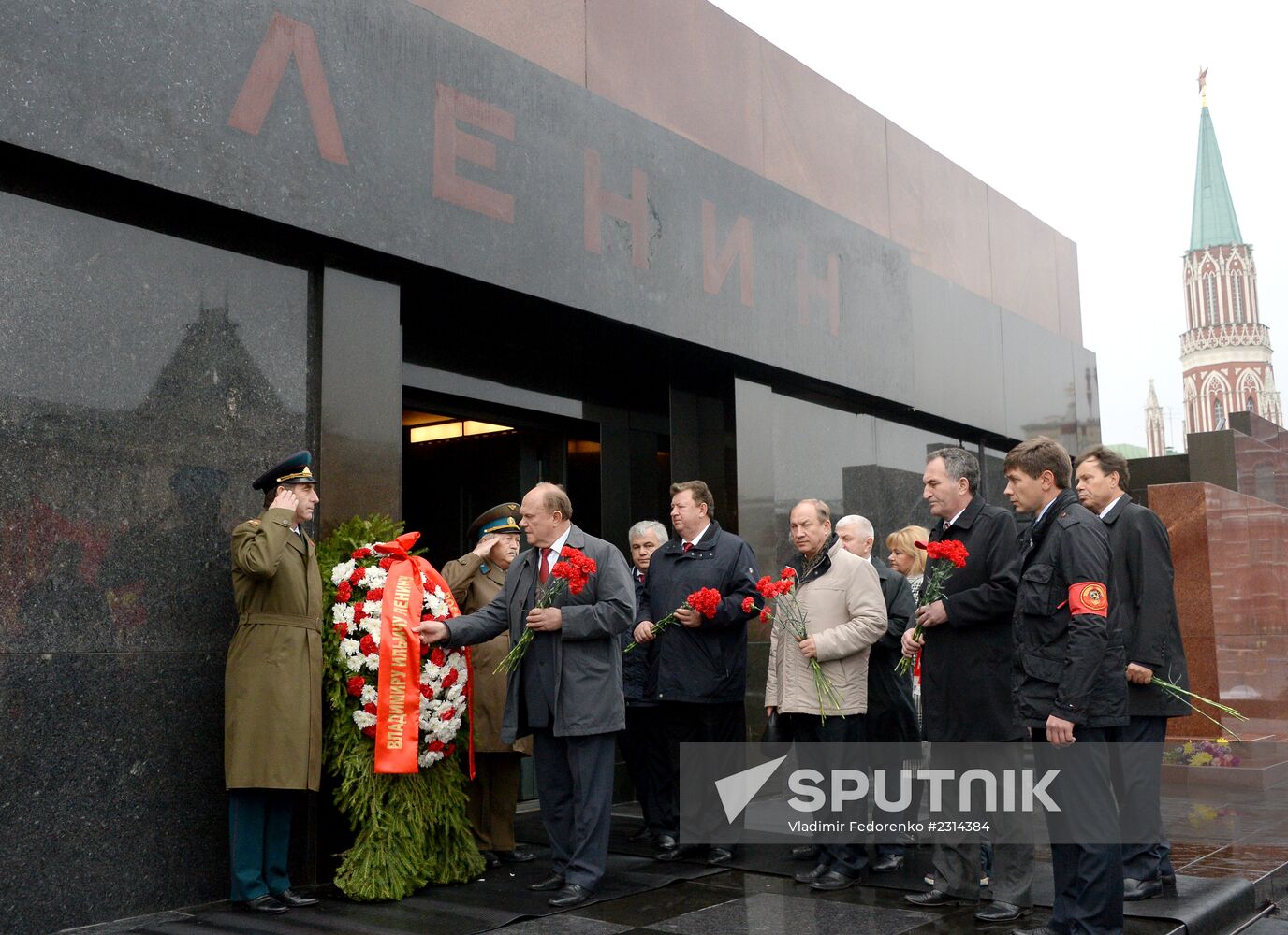 Laying flowers to Lenin Mausoleum on Red Square
