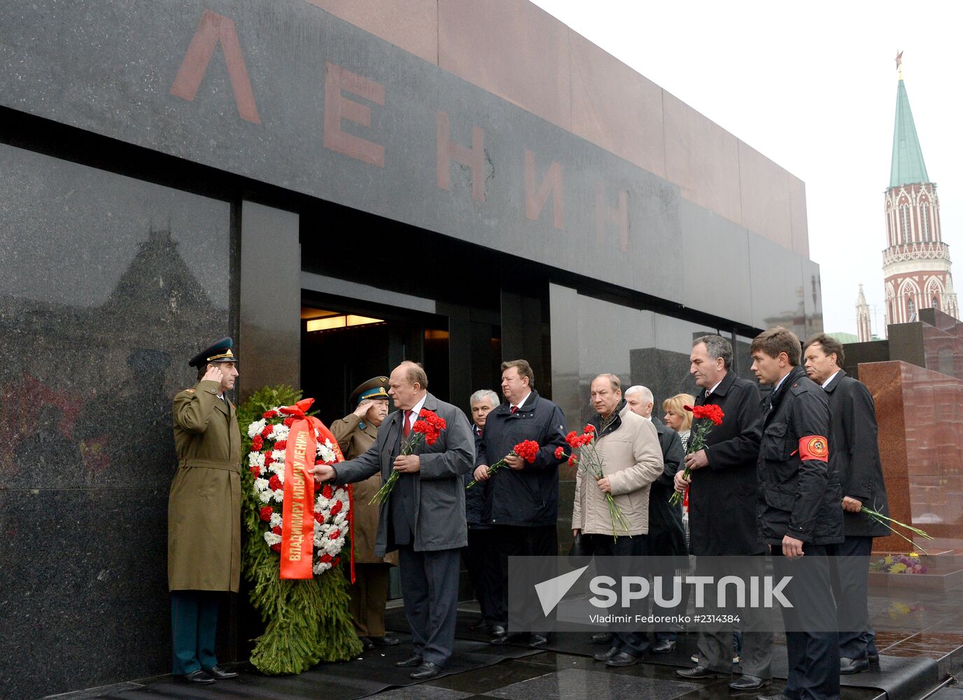 Laying flowers to Lenin Mausoleum on Red Square