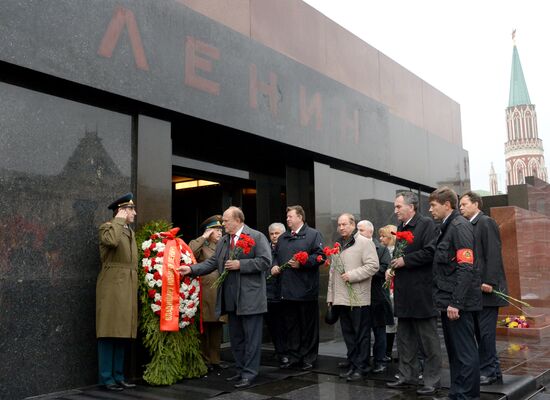 Laying flowers to Lenin Mausoleum on Red Square