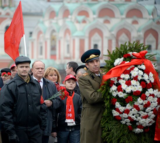 Laying flowers to Lenin Mausoleum on Red Square