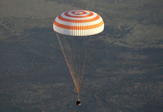 ISS capsule carries Olympic torch to Earth