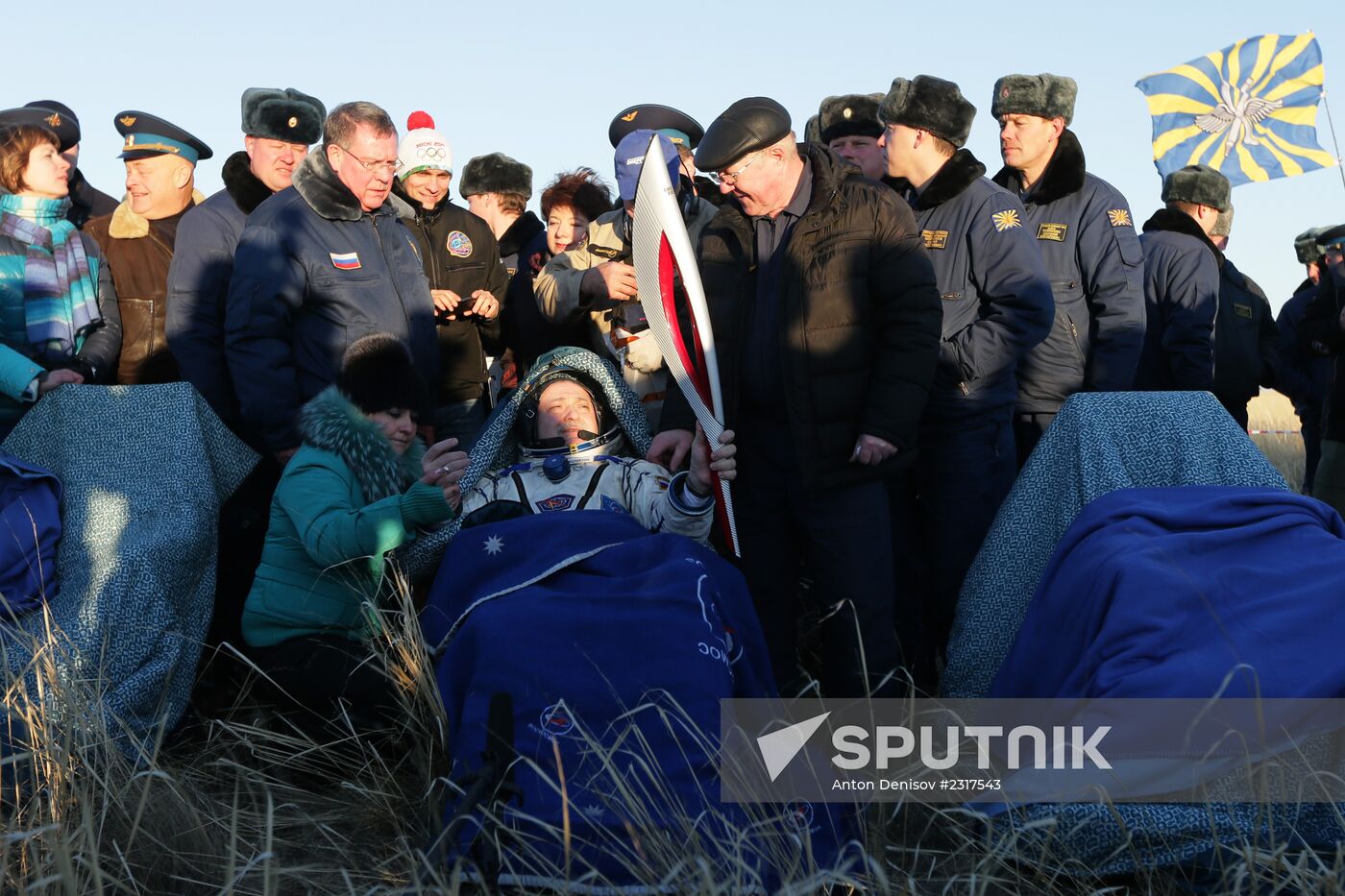ISS capsule carries Olympic torch to Earth