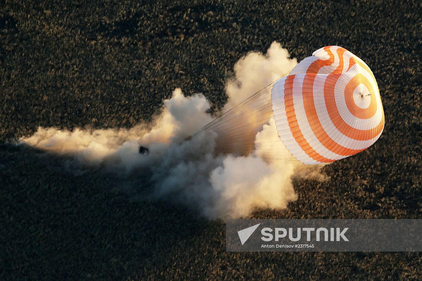 ISS capsule carries Olympic torch to Earth