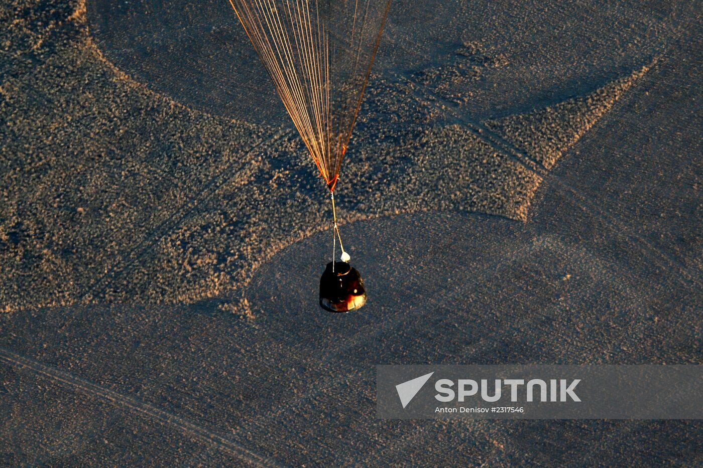 ISS capsule carries Olympic torch to Earth