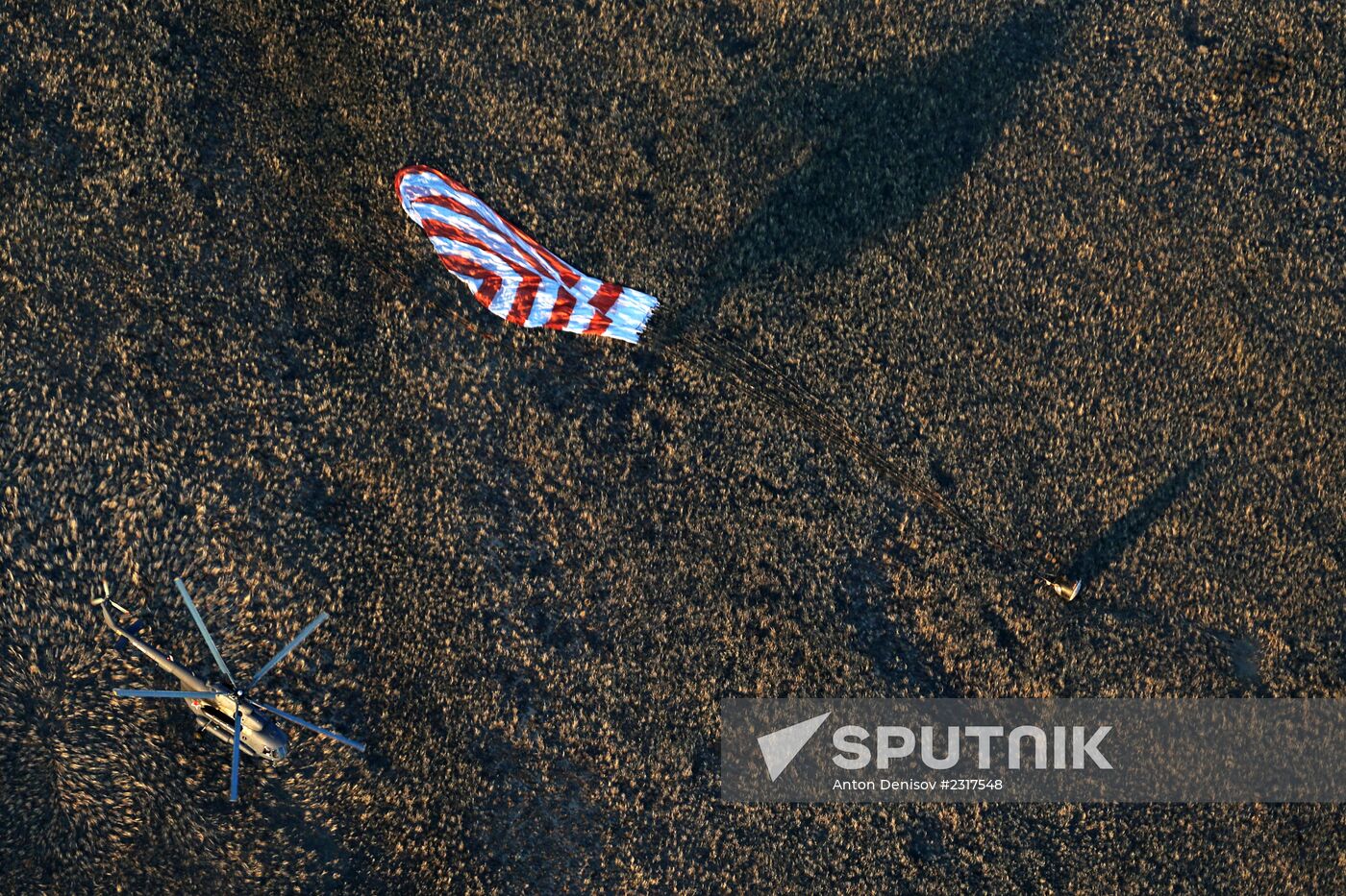 ISS capsule carries Olympic torch to Earth