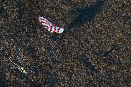 ISS capsule carries Olympic torch to Earth