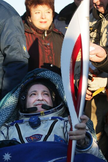 ISS capsule carries Olympic torch to Earth