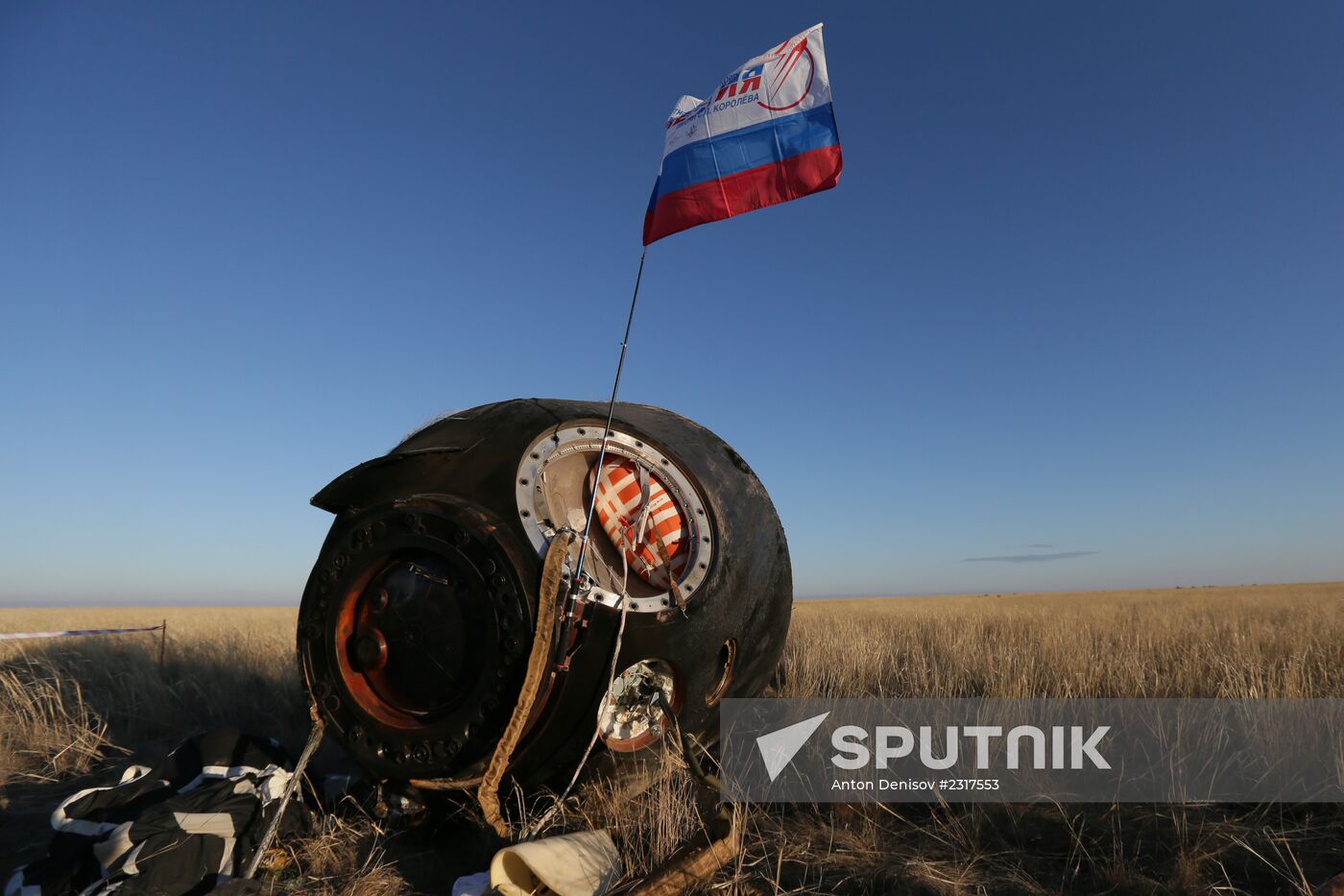 ISS capsule carries Olympic torch to Earth