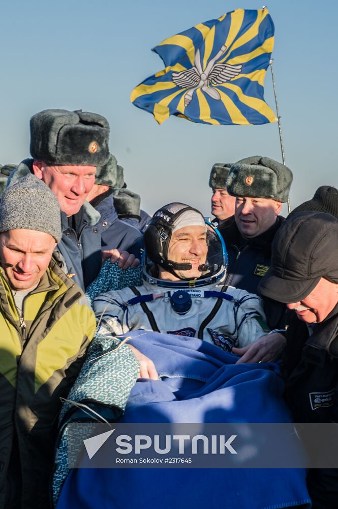 ISS capsule carries Olympic torch to Earth