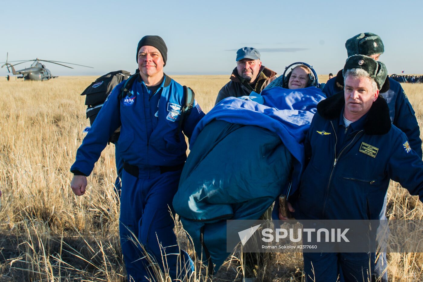 ISS capsule carries Olympic torch to Earth
