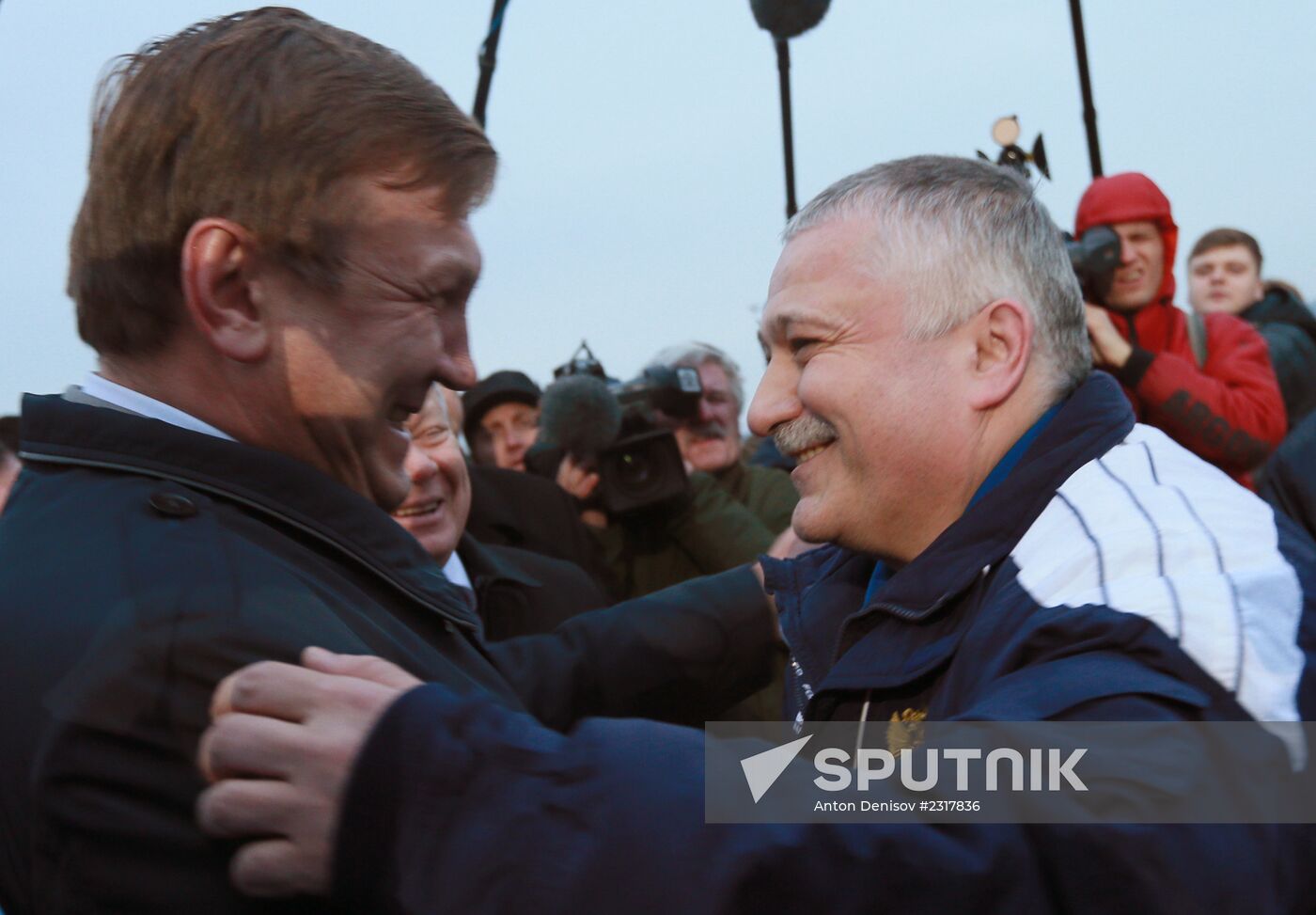 Cosmonauts return to International Space Station with Olympic torch after space flight
