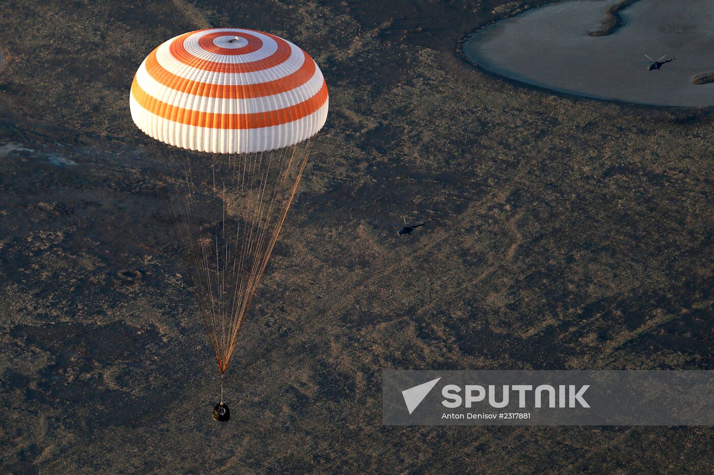 ISS capsule carries Olympic torch to Earth