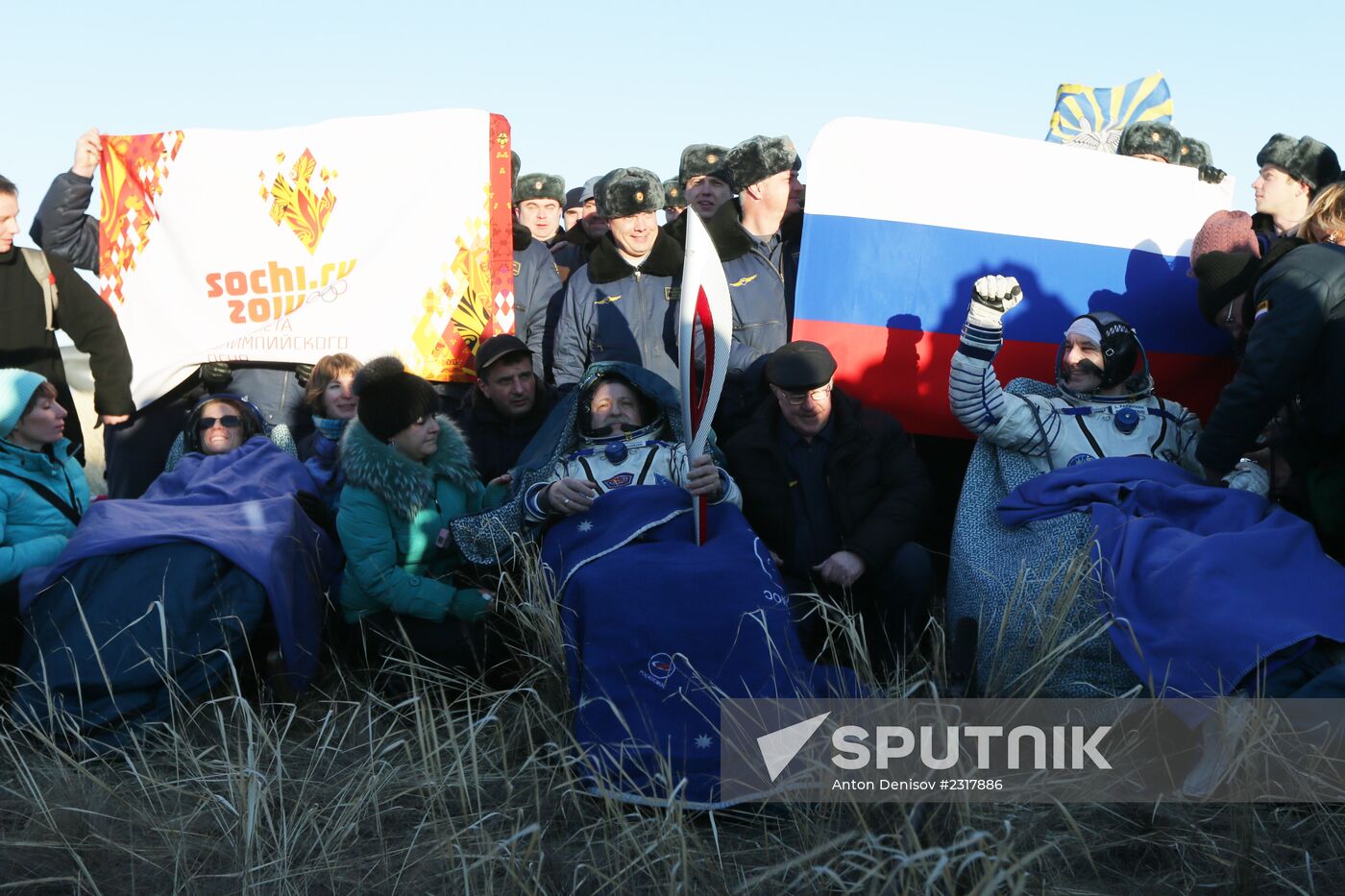 ISS capsule carries Olympic torch to Earth