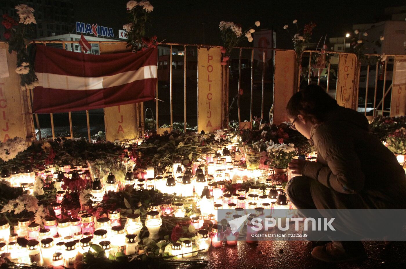 Riga residents mourn supermarket roof collapse victims