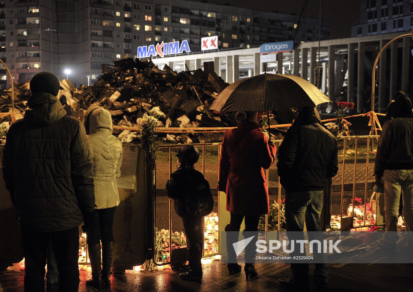 Riga residents mourn supermarket roof collapse victims
