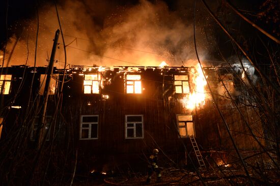 Fire in two-storey wooden building in Novosibirsk