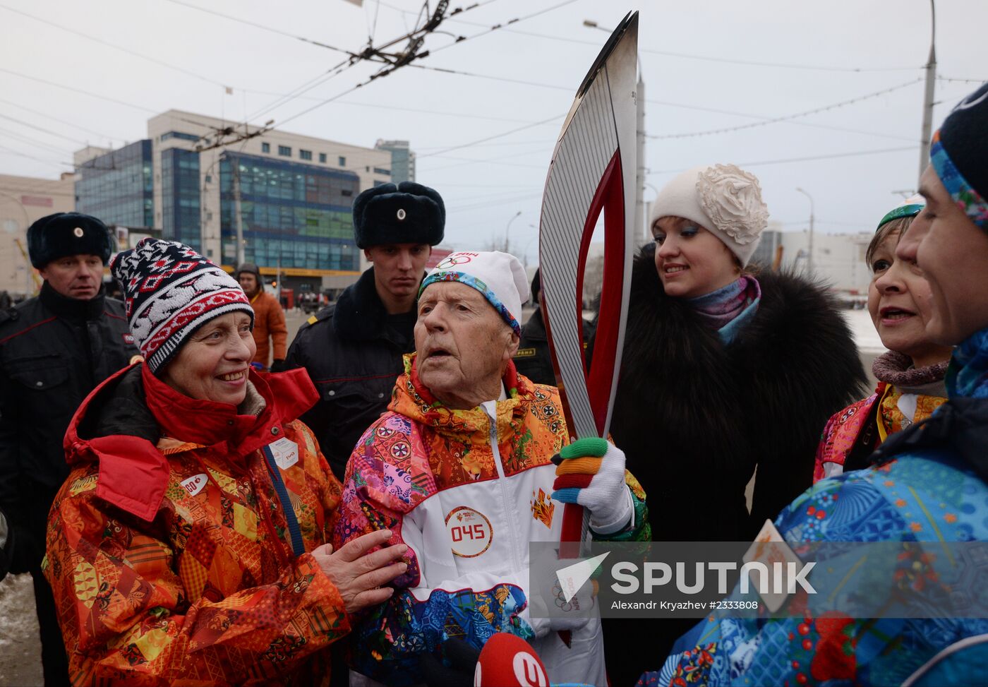 Siberian centenarian Alexander Kaptarenko carries the Olympic flame