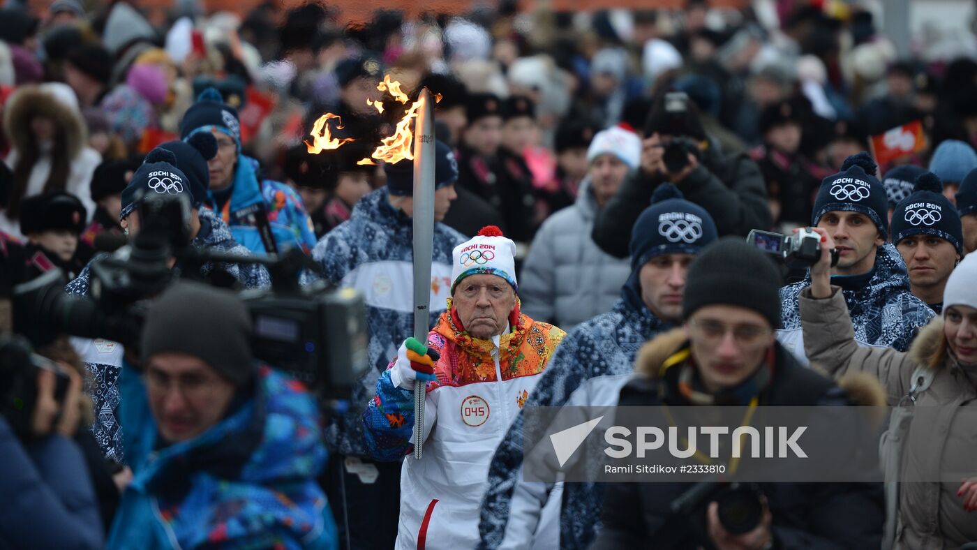 Siberian centenarian Alexander Kaptarenko carries the Olympic flame