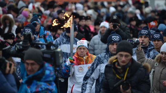 Siberian centenarian Alexander Kaptarenko carries the Olympic flame
