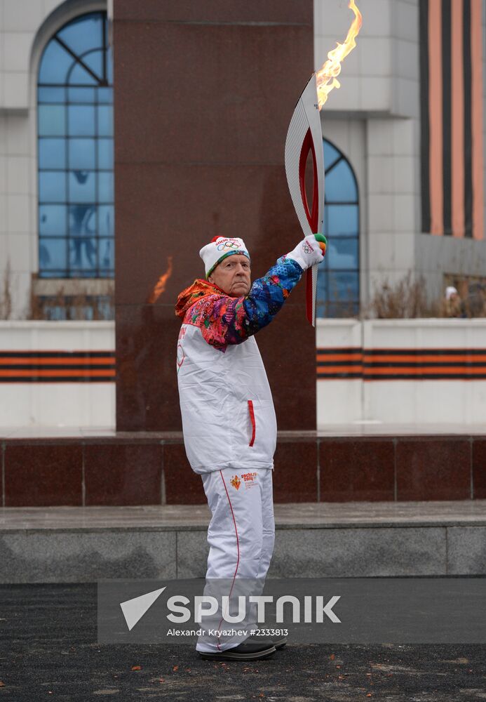Siberian centenarian Alexander Kaptarenko carries the Olympic flame