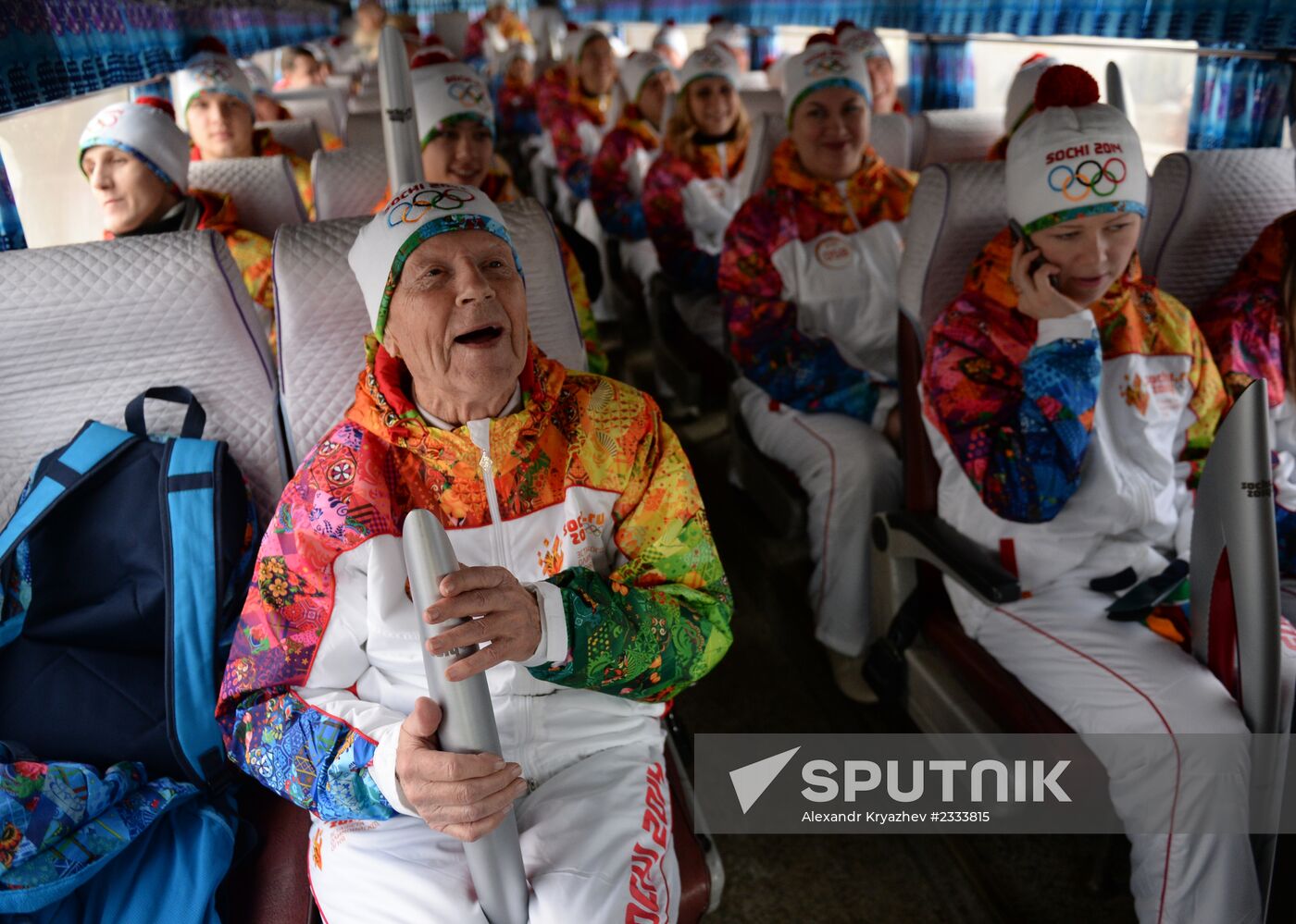 Siberian centenarian Alexander Kaptarenko carries the Olympic flame