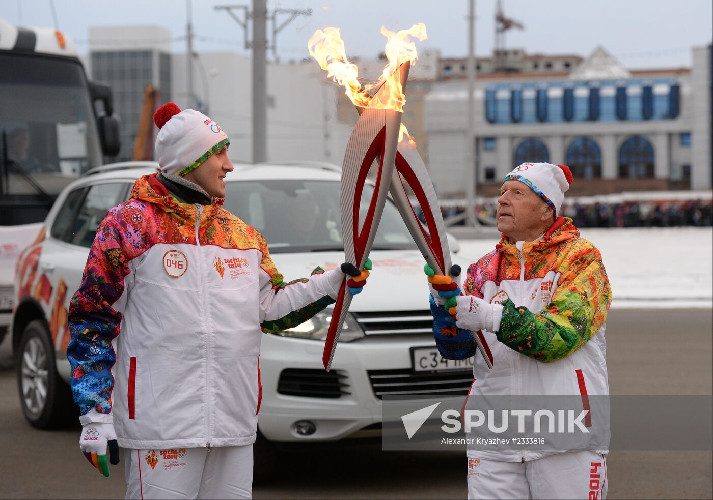 Siberian centenarian Alexander Kaptarenko carries the Olympic flame