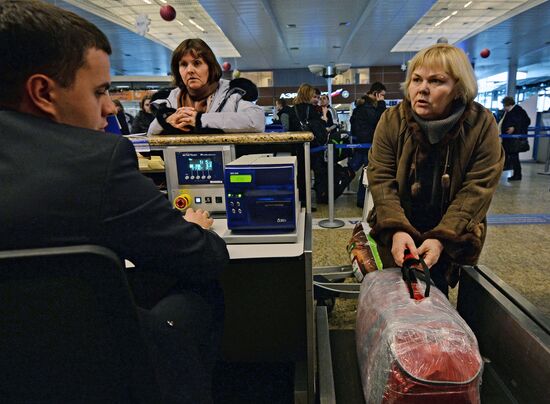 Check-in of luggage by passengers at Sheremetyevo Airport