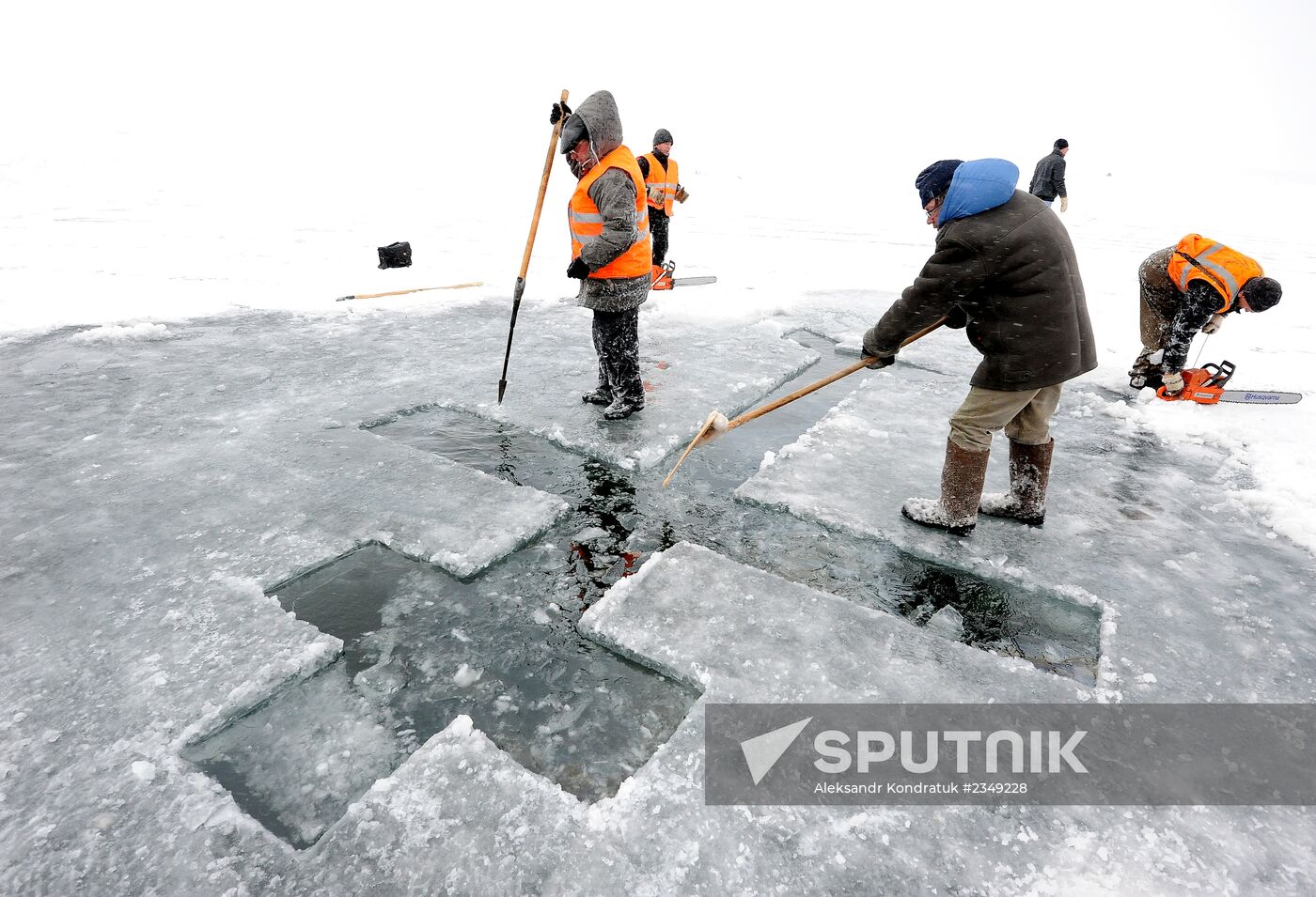 Preparation of ice holes for Epiphany bathing in Russia