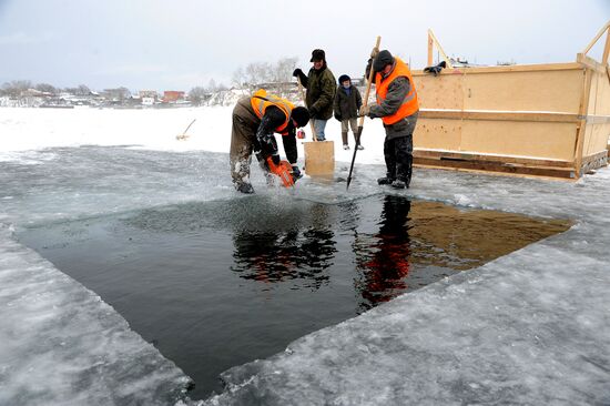 Preparation of ice holes for Epiphany bathing in Russia