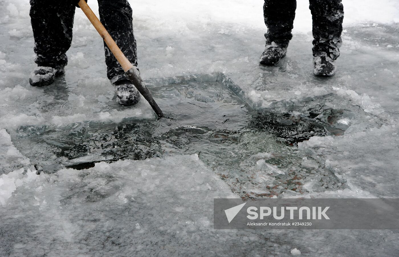 Preparation of ice holes for Epiphany bathing in Russia