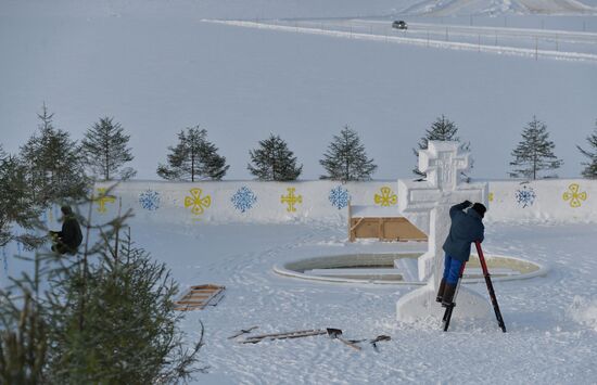 Preparation of ice holes for Epiphany bathing in Russia
